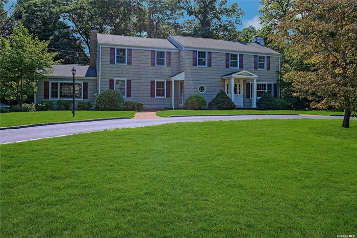 Welcome Home to this amazing expanded Colonial on Centerport&rsquo;s sought-after Vanderbilt peninsula and in Award Winning Harborfields School District. This warm and inviting home is an entertainer&rsquo;s delight, both inside and out. The first floor features a large kitchen with an amazing center island with seating and plenty of counter space. Cooks will love the double ovens, built-in refrigerator, 5-burner propane cooktop, Bosch dishwasher and pantry - it&rsquo;s truly a delight. There is also a 2-sided wood burning fireplace between the kitchen and the den. The light and bright den has built in bookcases, storage cabinets and the other side of the wood burning fireplace. There is also a large formal living room with an additional wood burning fireplace and French doors to the screened-in porch. A formal dining room, a powder room, 2 coat closets and a large laundry room (with closet, utility sink, and cabinets) complete the 1st floor. The 2nd floor consists of a huge primary bedroom with 4 double closets and an en-suite bathroom. The bathroom has a jetted tub, heated floor and a sky light. 3 more bedrooms with generous sized closets and an updated full bath with double sinks and large linen closet complete the second floor. Hardwood floors throughout the 1st and 2nd floor. Outside off the formal living room is a comfortable screened-in porch for those beautiful nights (no concern with bugs). Off the porch is a brick patio (overlooking your wooded property and also accessible from the dining room) with lighting and plenty of room for multiple seating and eating areas. The house has a basement with additional storage areas as well as finished areas. There is also a basement entrance to 2 of the 3 garages. The large driveway behind the house can store multiple cars and/or your marine toys. New natural gas 4-zone heating system and hot water heater. This house is close to the Centerport Yacht Club, Centerport Beach and the Vanderbilt Mansion. Move right in to this beautiful home and start enjoying the Centerport lifestyle.