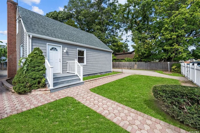 Fully renovated cape with new roof and sidings featuring 4 Bedrooms, 2 Full Baths and a finished basement w/side entrance. Enjoy brand new stainless steel appliances. Home comes with additional adjacent lot that can fit a few commercial vehicles. Walking distance to Roosevelt High School.