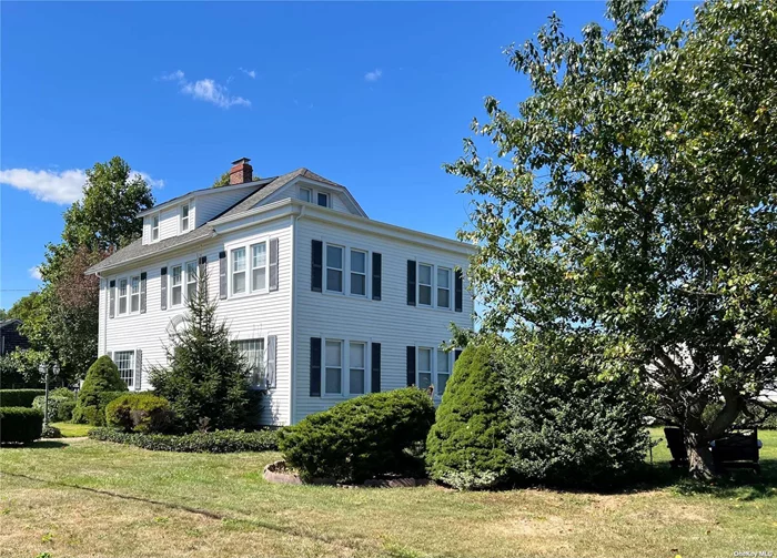 This Classic Colonial built in 1910 might need updating but has so many wonderful features. 2 fireplaces, 7 bedrooms, formal dining room and formal living room. Spacious kitchen and 4 bedrooms on the 2nd floor and 3 on the 3rd. The main bedroom has a sitting room. Home is in South Amityville.  It does not need flood ins.