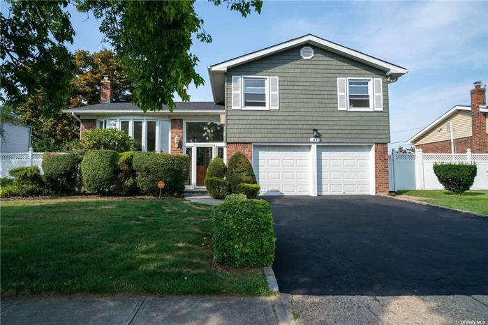 This newly renovated and expanded Split-level home boasts a striking brick exterior with new cedar siding. The spacious home spans four levels, including five bedrooms and three full bathrooms. It is in Westbury&rsquo;s sought-after Jericho Gardens neighborhood, within the esteemed Hicksville school district. The home features a living room and dining room adorned with elegant molding and railings, complemented by high hats and floor-to-ceiling windows that fill the space with natural light. A cozy fireplace adds warmth and charm to the rooms. The house also has a new eat-in kitchen with stainless steel appliances, granite countertops, and easy access to a large patio and deck, perfect for entertaining and relaxation. The upper level boasts a generously sized primary suite with a newly renovated private full bath, two more bedrooms, and another new full bath, all with beautiful hardwood floors throughout. Moving to the lower level, you&rsquo;ll find a spacious family room, several bedrooms, a full bath, and an expanded room with a relaxing Jacuzzi, ideal for unwinding after a long day. The property includes a large finished basement and an attached two-car garage. It also offers modern amenities such as gas heat, new Bosch tankless water heater, energy-efficient windows, and smart home technology integration. In addition, the roof, siding, electrical system, kitchen, and flooring were all updated in 2024, ensuring a contemporary and well-maintained living space. You don&rsquo;t want to miss out on this fantastic house, conveniently located near fabulous shopping and beautiful parks.