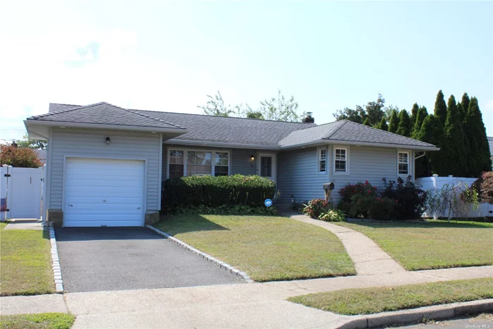 Host the Holidays with this Rare Open Concept Ranch. The Updated Kitchen Featuring a Huge Island with Seating, Granite Counters and Stainless Appliances is Open to the Living Room and Dining. Hardwood Floors Throughout. partially Finished Basement with Bonus Room. Access to the Large Deck is Via the Sliding Doors to an Oversized Yard. Bethpage Schools. Hurry!