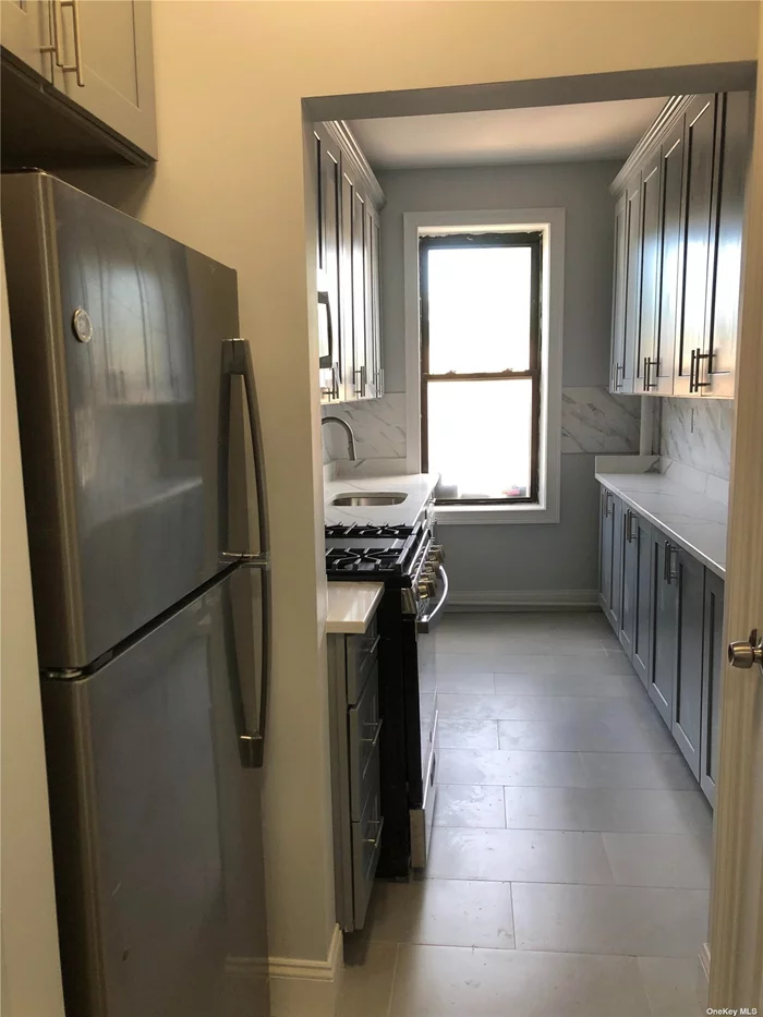 Modern large one bedroom apartment, one full bath, kitchen with granite countertop with stainless steel appliances, huge, combined living room, dining room, hardwood floor, plenty of closet, walk to train and buses walk to shopping center, monthly parking available