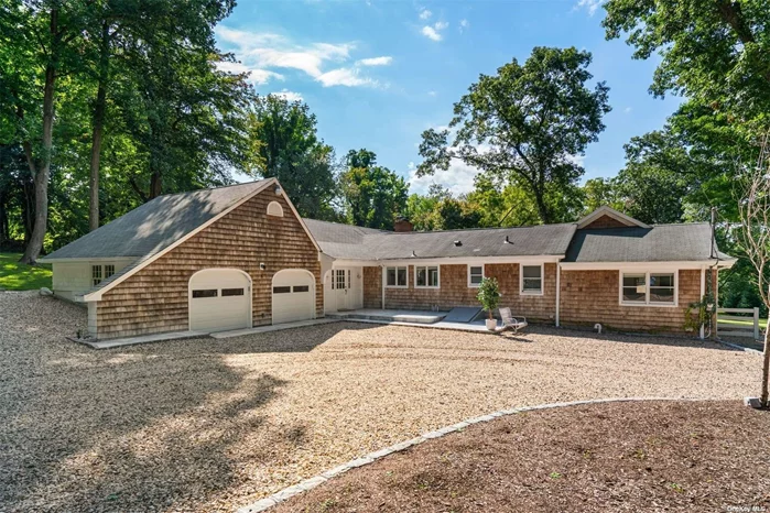 Discover this elegant 4 bedroom, 3 bathroom sprawling ranch, nestled on 2 lush acres adorned with mature plantings and vibrant perennials. Step into the vaulted ceiling living room, where walls of windows frame picturesque views of the park-like grounds. The updated kitchen is a chef&rsquo;s dream, featuring granite countertops, stainless steel appliances, and a cozy sitting area with a fireplace that doubles as a charming eat-in kitchen. The spacious ensuite primary bedroom offers a private retreat, complete with an office nook, built-in closest and Anderson windows that showcase breathtaking scenery. The first-floor bathroom has been beautifully renovated with luxurious Carrara marble, adding a touch of sophistication. Enjoy the warmth of new wood floors in the primary bedroom and restored wood floors throughout the home. A brand-new gravel driveway, enhanced with thoughtful plantings, adds to the home&rsquo;s curb appeal, welcoming you in style. Outdoor entertaining is a breeze with a wonderful porch and patio, perfect for gatherings or quiet relaxation. Plus, with a full-house generator. Winter waterviews. Parking is never an issue, and you&rsquo;ll enjoy access to a private beach, complete with mooring rights, kayak rack, swing set, picnic tables, and BBQ areas (Dues $425 yr). Situated just 5.2 miles from Northport Village, residents can easily access the vibrant amenities, including the renowned John Engeman Theatre, restaurants, dock, The Northport Hotel and a bustling farmer&rsquo;s market (seasonally). With the added convenience of being only 56 miles from NYC, this property offers the perfect blend of tranquility and accessibility for a coastal lifestyle.