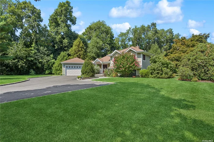 STUNNING SETTING! 1.33 acres in the Flower Hill area of north Huntington. Located in a cul-de-sac at the end of a private road, separated by stone columns. Peaceful & private! Completely remodeled 2013. New cherry kitchen, baths, heating, CAC, windows, doors, hardiplank siding, roof, wainscotting! Brazilian cherry floors. Rocking chair porch with lovely views. Buderus hi-end boiler. 3 heating zones plus radiant heat. 3 CAC zones. Tennis court & Gazebo! Perfect setting for a pool! Natural gas brought in 2 years ago. Wonderful opportunity! Exquisite, Private, Quiet Setting!