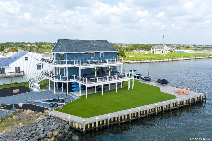 This Brand New Bay Front home has 270 degrees of open water views. The most Amazing Sunrises and Sunsets every day!!! This Bay Front home has 2825sqft of indoor living (5 BRs and 3 Full Baths) and 1700sqf of Outdoor Living (Custom Decks) for a total of over 4500sqft of total space. There is a Huge custom kitchen (Open Concept) with ALL Thermador Appliances including 6 ft. of Refrigeration. There is a Wet Bar with an icemaker and B\a beverage refrigerator. Newer Bulkhead with New 10k boat lift and 2 New Jetski lifts. This House is Elevator ready. There is an elevator shaft and power all ready run for it. The Backyard has 5000sqft of Brand New Turf. Looks Great ALL year long!!! EV Changer installed, Sonos Radio 3 zones. Primary BR has a Bidet and Steam closet. Many extras... This Gem won&rsquo;t last long!!