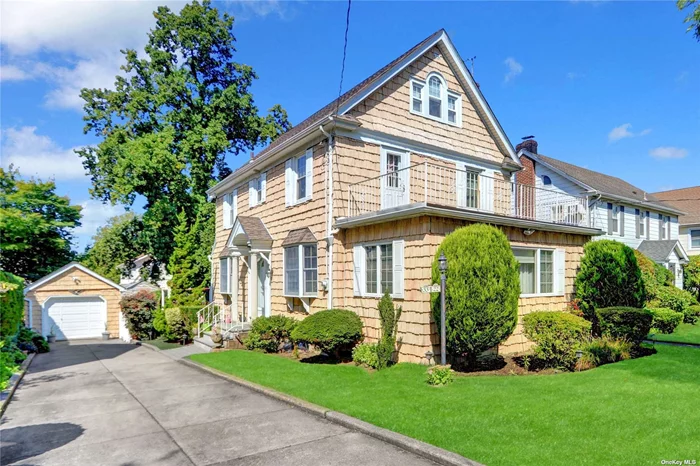 Location, Location, Location, ThisSpacious 1935 Center Hall Colonial offers 3 bedrooms, 2.5 Bath on a 50x100 lot has a prime Flushing location with convenient access to the Broadway LIRR a few blocks away, bus lines to Main Street and nearby shopping. Enter into the spacious foyer and then to the formal living room with fireplace leading to a Den. The large formal dining room connects to the eat-in-kitchen with its own entry door that leaks to a deck, 1/2 Bath completes the first floor. The first floor hallway offers a staircase leading to the second floor with Spacious Primary Bedrooms and 2 add&rsquo;l bedrooms and full hallway bathroom. Original hardwood floors throughout and ample closet space. There is a 3rd floor accessed through the hallway which offers many possibilities and storage. Basement with Rec Space, laundry area, Storage and utilities. The property has a long private driveway, detached garage and lovely backyard. Very large and spacious home in the ideal location. Beautiful Hardwood Floors Throughout, Gas for Cooking and Oil for Heat and 4 Mini Splits for AC, Deck for easy entertaining off Kitchen. Many updates which makes this home ready for its next owner to move in.  R2A Zoning