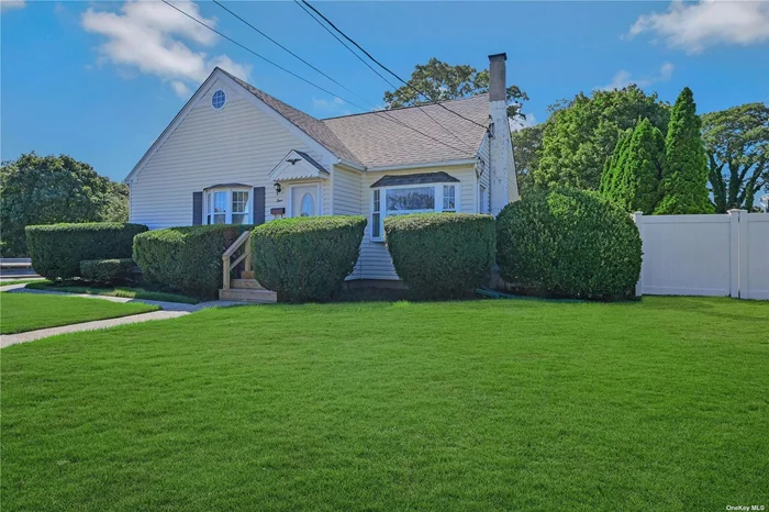 Welcome to this cheerful sunlit home, meticulously appointed with neutral palette and open flow. blended with yesteryear charm of arch doorways, wainscotting, and plantation shutters as well as hardwood floors through out, raised panel doors and crown moldings. The charming character combines with many energy saving upgrades- LED lighting, new heating system and 200 amp service. Spacious primary bedroom on main level plus additional large bedroom with large wall to wall closet on second level, third bedroom and unfinished storage room on second level holds future possiblities as bonus room. Den opens to deck with electric awning and fully fenced private yard. Oversized detached garage with workshop plus spacious basement with work bench and loads of storage and outside access from side door. Low taxes and convenience to Patchogue Village amenities/eateries, shopping, ferry to Fire Island and easy access to LIRR make this an incredible opportunity!