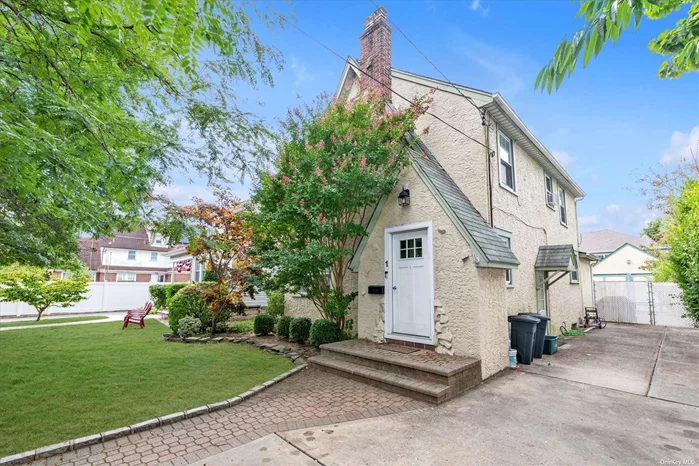 Welcome to 1 Kathryn Street A Charming home nestled in the Incorporated Village of Lynbrook. Step inside to discover hardwood floors adorned with intricate inlays, creating an atmosphere of warmth and elegance. The generous living area is graced with a wood-burning fireplace, providing a cozy setting for relaxation and entertainment. Adjacent to the living room is a formal dining room, offering ample space for hosting dinner parties or intimate meals. The heart of the home features an inviting eat-in kitchen, boasting solid wood handmade cabinets that offer tons of storage space and stainless steel appliances. A versatile three-season room that can adapt to your lifestyle needs and Powder Room complete the first floor. On the second level you will find four bedrooms with plenty of closet space, a full bathroom, and a walk up attic. This home also has a full basement with laundry room and utilities. 100 Amp Electric, Hot Water on Demand, 1 Zone Steam Heat, Sprinkler System, 1.5 car detached garage with own sub-panel, Gas in house. Situated in the welcoming community of Lynbrook, this property is surrounded by a variety of local amenities. The town offers a vibrant mix of dining, shopping, and recreational options, ensuring there&rsquo;s always something to see and do. Taxes Do Not Reflect Basic Star Rebate of $1, 384.99