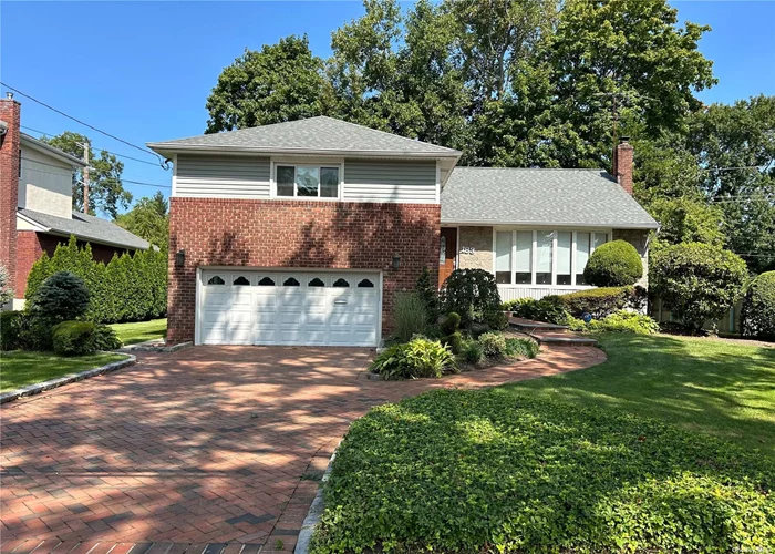 Herricks School! Spacious, newly renovated home with hardwood floors in Manhasset Hills. Includes updated kitchen and bathrooms. The living room boasts large bay windows that flood the space with natural light, creating a light and airy atmosphere. The formal dining room provides an ideal setting for gatherings. The eat in kitchen has been recently renovated with a skylight. Primary bedroom includes a full bath and walk in closet. Lower Level has a large Family Room with 1/2 Bath and outside entrance. Finished basement with plenty of storage. This property also has Central Air with a two car garage and large backyard for both relaxation and entertaining. Close to Highways, Parks, Golf Courses, Hospitals.