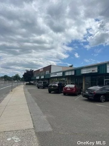 Unlock the potential of this unique and versatile property situated in a high-traffic area of West Babylon on Sunrise Highway. Spanning over 48, 951 sq. ft., this commercial property offers a remarkable opportunity for investors or developers seeking to capitalize on a prime location with substantial growth potential. The main building features 6 ground-floor storefronts of varying sizes, previously occupied by diverse businesses such as a yoga studio, mattress store, law firm, and doctor&rsquo;s office. This variety showcases the building&rsquo;s flexibility for a range of retail or service-oriented uses. The rear of the building has a 16-foot high garage door with an attached office space that provides an ideal setup for automotive businesses like tinting or detailing. This addition enhances the property&rsquo;s functionality and appeal. The second floor includes 9 adaptable suites, ranging from single-room to four-room configurations, with the potential for expansion. Common bathrooms on this level add to the convenience for tenants or occupants. Included in the purchase is a freestanding house, commercially zoned, adding further value and flexibility to the property portfolio. The property boasts substantial parking space at the rear, accommodating both customers and tenants with ease. Benefit from a daily traffic count of 76, 000 vehicles, ensuring high visibility and consistent footfall. With its expansive lot and strategically located position, this property offers significant opportunities for redevelopment or enhancement. The existing building&rsquo;s versatile layout, combined with the commercially zoned house, provides a solid foundation for various business ventures or residential conversions. Whether you&rsquo;re looking to maintain the current use, explore redevelopment options, or lease out individual spaces, this property represents an excellent investment opportunity. The combination of high traffic exposure, diverse existing spaces, and development potential makes it a valuable asset in a thriving commercial area.