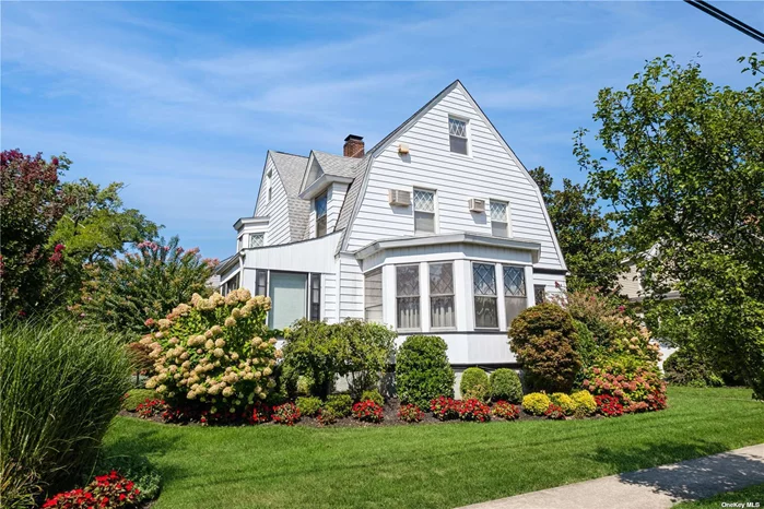 First Time on the Market: A Timeless Center Hall Colonial Welcome to a beautifully landscaped gem that epitomizes classic charm and modern convenience. This expansive Center Hall Colonial invites you in through a grand foyer featuring a cozy fireplace, setting a warm and elegant tone from the moment you step inside. To the left, the formal living room boasts abundant natural light through a large bay window and includes a distinct sitting area, perfect for relaxing or entertaining. Adjacent to the foyer, the formal dining room offers an ideal space for gatherings and special occasions. The heart of the home is the extra-large kitchen, which seamlessly connects to the dining room and features a spacious pantry, a laundry area, and additional space for a second kitchen if desired. A convenient powder room completes this level. Just a few steps up from the kitchen, you&rsquo;ll find a welcoming family room and a charming enclosed porch, offering serene views of the meticulously maintained grounds. On the second floor, the primary bedroom is a tranquil retreat, complete with generous closet space and ample sunlight. This level also includes two additional well-sized bedrooms and two full bathrooms, providing comfort and convenience for all. The uppermost floor features a full attic with two additional bedrooms and a full bathroom, offering versatile space for guests, hobbies, or a home office. This exceptional property combines classic architecture with modern amenities, presenting a rare opportunity to own a truly unique and beautifully maintained home. Don&rsquo;t miss your chance to make it yours!