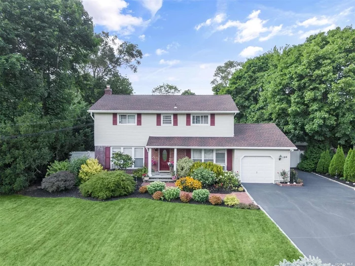 Nestled on a sprawling half-acre lot within the prestigious Commack school district, this beautifully maintained 4-bedroom, 2.5-bath colonial is surrounded by meticulously landscaped gardens, this residence boasts a sparkling swimming pool, and an entertainer&rsquo;s backyard perfect for summer fun and relaxation. Recent upgrades include updated windows, roof, siding, cesspool, and an updated kitchen. Step inside to find gleaming hardwood floors throughout, leading you through a spacious living room, a grand formal dining room, and a comfortable den. The eat-in kitchen is a chef&rsquo;s delight, featuring stainless steel appliances, ceramic tiles, Maple cabinets with ample granite countertops, and a convenient breakfast bar. The kitchen overlooks the expansive yard, offering picturesque views of the beautiful gardens. The outdoor space is a true staycation haven, featuring a fully fenced area perfect for gues , vegetable garden beds, and an inviting swimming pool. Entertain guests on the outdoor deck adjoining the house or unwind in the paved courtyard area. The pool deck provides ample space for sunbathing and hosting gatherings.This charming home shows pride of ownership & combines traditional elegance with modern upgrades, providing space and privacy for all who are home to relax. Don&rsquo;t miss this rare opportunity to own a piece of paradise in the heart of Commack.