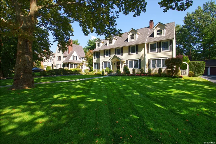 Welcome to 41 Magnolia Avenue! This beautifully renovated center hall colonial offers an exceptional flow with modern updates on a 75x150 lot, featuring 5 bedrooms, 3 full baths, and 2 half baths. From its storybook curb appeal to the gorgeous foyer, this home exudes elegance. The first floor includes an inviting dining room, a sophisticated living room, a versatile sunroom/office, and a huge kitchen great room perfect for gatherings. You&rsquo;ll also find a well-designed mudroom with laundry, radiant heat, a half bath, and separate entrance. The second floor is highlighted by a grand primary suite, complete with a sitting room, walk-in closet, and a spa like bathroom with radiant heat. Two additional generous-sized bedrooms and a new full bath complete this level. The third floor offers two more large bedrooms and a newly renovated full bathroom, providing ample space for everyone. The basement features a large recreation room, a half bath, and plenty of storage space. Step outside to a meticulously maintained turf yard, perfect for outdoor activities and large paver patio ideal for entertaining. Additional features include whole-house water filtration, third-floor sprinklers, central air conditioning, completely fenced-in yard, radiant heat,  in-ground sprinklers, security system, 2 car garage w EV charger, and more. Close proximity to town, schools, park, LIRR, & shopping.  With its timeless charm, impeccable craftsmanship, and low taxes this home is truly a rare find. Don&rsquo;t miss the opportunity to make this stunning colonial your new home.