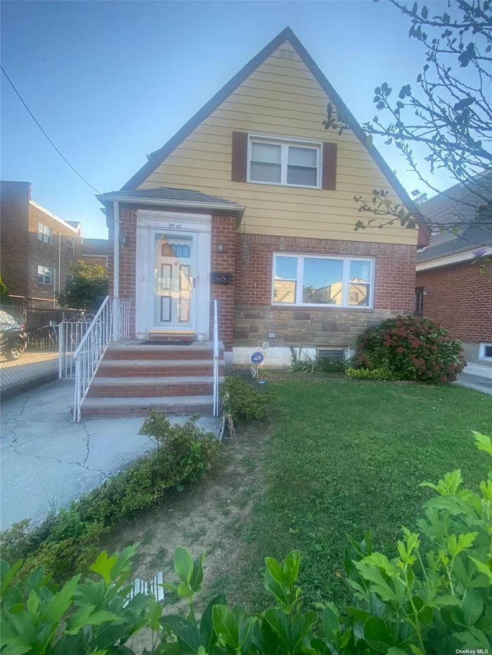 Location location location. Beautiful brick two family home just steps away from the Long Island railroad and trendy Bell Boulevard. Beautiful clean and bright hardwood floors throughout. Very good condition. Large full basement.