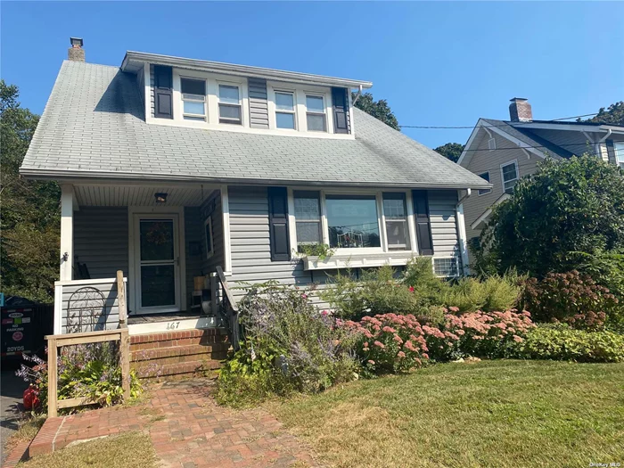 This charming 1920&rsquo;s colonial has much to offer.  Conveniently located near to Patchogue village. Brick stoop and cozy front porch leads into the entrance foyer.  Oversized living room is drenched with late day sun, featuring all newer windows.  Formal dining room can accommodate a banquet sized table, and features a window seat along side. Updated kitchen with stainless gas stove and marble countertops. The comfortable den has tiled flooring and sliders that lead to a tremendous Vinyl deck overlooking a deep fenced yard.  There is original pine flooring througout most of the home as well as some original woodwork and stair rails. Upstairs are 3 bedrooms and a full Bathroom.  Interior and exterior doors lead to unfinished basement and laundry area. New gas furnace. Won&rsquo;tlast long!