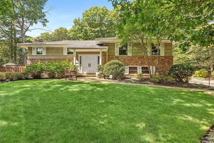 Tucked away and perfectly situated on .77 park like acres in the Half Hollow Hills East School District sits this elegant home with versatile floor plan. Double door entry leads into the grand foyer which showcases the impressive family room with wood burning fireplace as well as the soaring ceilings of the main level. Lots of windows and skylights offering amazing light into each area of the home. Gourmet custom kitchen complete with large center island with seating, wine refrigerator, decorative open shelving, storage and convenient 2nd sink. Sub zero refrigerator, Wolf Range and 2 Dishwashers plus the gorgeous Trex deck/balcony which wraps around the side of the home by the dining room and along the rear of the home with sliders from the great room makes this home a true entertainers delight. Primary suite with its own private balcony, full bath and walk in closet. In addition to the lower level family room this floor also boasts an office/craft room, bedroom with access to full bath, laundry room and a den, plus access to 2 car garage. In Ground Salt Water pool and paver patio plus beautifully landscaped grounds. Gas Heat, CAC, Cathedral Ceilings, Skylight & gleaming hardwood floors. In Ground Sprinklers. Home Sweet Home!