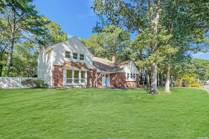 Stunningly renovated 4-bedroom, 2.5-bath colonial, modern elegance meets impeccable style! With brand-new flooring throughout, hi-hats, and statement lighting, every room is designed to impress. The open-concept layout seamlessly connects a spacious kitchen, large eat-in area, and family room with an electric fireplace. The kitchen features all the must-haves: stainless steel appliances, ample pantry space, and the highly sought-after pot filler. The sunken dining room adds a unique architectural touch to your first floor. Three generously sized bedrooms share a sleek full bath, complemented by ample walk-in hall closets. The primary suite offers two large closets and an ensuite bath with modern fixtures that exude sophistication. This home also features 2-car garage, first-floor laundry, large private yard, central air.