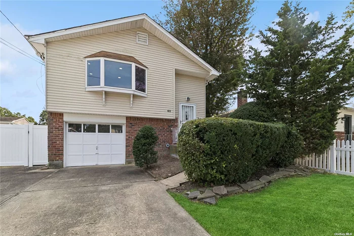 This is a 4-Bedroom Inline Hi-Ranch with a separate 1-Bedroom Living Space on the first floor. The second floor has wood flooring throughout and the living room is a bright, inviting space, featuring a large bay window that fills the room with natural light. The second floor also has a well-appointed kitchen and a recently updated bathroom. Additional highlights include Anderson windows, central air-conditioning, and a high-end 2015 Burnham heating system. This home is conveniently located close to all major highways, public transportation, schools, the renowned Babylon Village, and shopping, making it an ideal choice for those seeking both comfort and convenience.