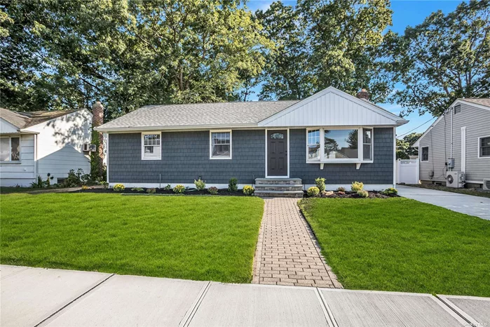 Beautiful totally renovated house inside and out! MOVE IN READY! New siding, driveway, garage door and flower beds, Bright and airy with new kitchen, bathroom, and gleaming hardwood floors throughout. Located in Seaford school district, walk to all schools and railroad.  A MUST SEE........