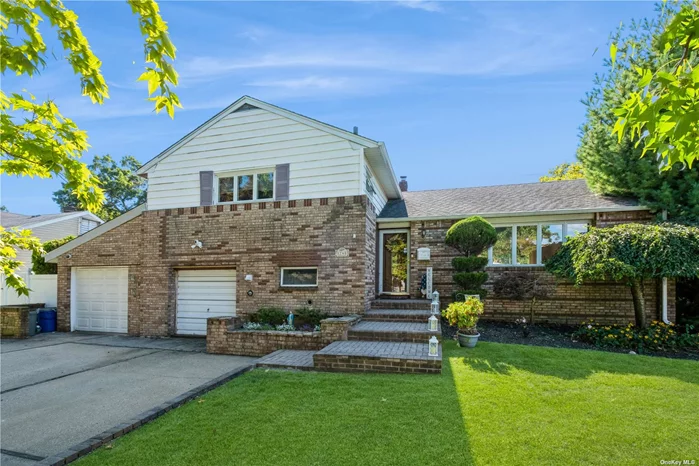 Spacious, sun-filled, and close to everything! This move-in ready, Split-Level home offers four bedrooms, two and a half bathrooms, finished basement and is located in the Barnum Woods section of East Meadow. With tons to offer both inside and out, this home includes neatly manicured front and back yards, a large deck, and a spacious interior with gleaming hardwood floors, crown molding, recessed lighting, and generous windows bringing in lots of natural light. On the main level, the open layout is flooded with light from a huge picture window in the living room and sliding glass doors in the formal dining area. Step outside to a large deck and enjoy cookouts overlooking the privacy-fenced back yard. The open flow continues into the updated eat-in kitchen featuring granite counters, stainless steel appliances, and warm wood cabinetry with custom crown molding to the ceiling. Upstairs is the primary bedroom with a walk-in closet and its own private bathroom, two additional bedrooms, and a full hall bathroom. A few steps down from the main level is the warm and inviting den with a wood-burning fireplace set in an exposed brick wall and an outside entrance. This level also includes a fourth bedroom, a half bathroom/laundry room, and access to the garage. There&rsquo;s even more living space with a large recreation room in the finished basement, plus lots of storage. The home has approx a 4 year old heating system a 1 year old central air-conditioning.  This home is located close to the 930-acre Eisenhower Park with golf courses, a pool, many ball fields, playgrounds and skating rinks. Also, many options for grocery stores, eateries, schools, close to the Meadowbrook and Southern State Parkways making for an easy commute and quick access to South Shore beaches. All the elements needed for comfortable everyday living.