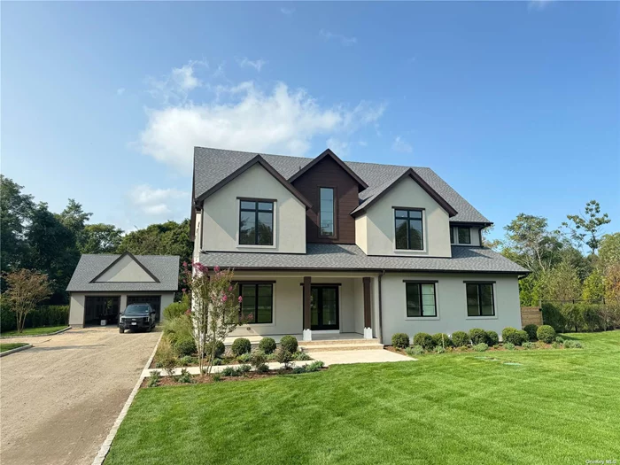 Another beautiful new construction home by one of Long Island&rsquo;s most coveted construction companies, Modern Age Home Builders! 2350 Shipyard Ln features a European style modern design home with the first and second floor totaling 4, 000 sq ft. with a detached oversized 2 car garage (with an electric car charger), all sitting on over 1.5 acres of land. The first floor consists of a large foyer that leads to an open and airy great room and kitchen which is perfect for entertaining guests and hosting gatherings. The great room has a linear gas fireplace, accented with a stunning, large format tile. The kitchen is finished with custom 2 stage cabinets, custom quartz countertops, and a top of the line 7-piece appliance package. There is also a living room, dining area, mudroom, half bath, and master ensuite. The second floor consists of a master ensuite, 3 secondary bedrooms, and 2 additional full bathrooms. Additionally, there is a study, laundry room (including a washer and dryer), as well as a loft which can easily be converted into an addition bedroom or anything else you desire! All closets are dressed with custom wood shelving and all bathrooms consist of custom cabinets, quartz countertops, and imported Italian tile. The master ensuite and loft each have their own balconies. The home also has a large, nearly 2, 000 sq ft, semi-finished lower level which is ready to use as is or you can truly make it your own. The basement will be delivered with insulated laminate floors throughout, as well as drape wall insulation and a finished bathroom! It has large egress windows that allow for natural light, perfect for finishing. There are two covered patios in the back along with a 20&rsquo; x 40&rsquo; inground swimming pool and just steps from the beach!