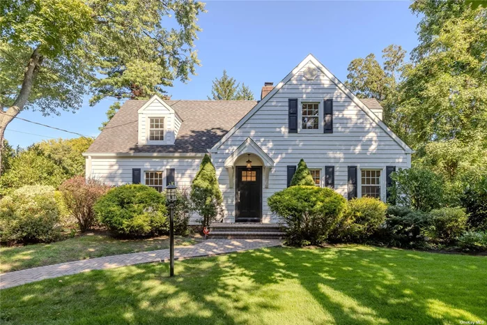 Welcome home! This 3 bedroom 3 bathroom expanded cape has it all! The long driveway to the 2 car garage and ample parking area allows for privacy. The paver walkway to the front door enhances the charming nature the the yard. Upon entering, the entry foyer has a coat closet for guest convenience. The stunning wood floors lead you to French doors as you arrive at the living room with a wood burning fireplace and dining room. The French doors from the dining area open to an outdoor breezeway covered patio and backyard. The eat in kitchen features stainless steel appliances and granite countertops. Off the kitchen is a hallway to the family room, office/laundry room and a full bathroom and access to the finished basement with an outside entrance. As you ascend the staircase to the second floor, the skylight is all the lighting that is needed. The primary bedroom has a private bathroom and walk in closet. There are two additional bedrooms each with walk-in closets. They share a hallway bathroom and a extra storage closet. The basement is finished with a recreation area and wood burning fireplace. There is a large storage room with utilities and a separate outside entrance.