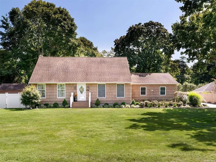 This renovated cape-style home offers a blend of modern convenience and classic charm. Upon entering, you&rsquo;re greeted by a tastefully decorated living room featuring new wide plank flooring and fresh paint, complemented by a corner electric fireplace, creating a cozy atmosphere. The recently renovated eat-in kitchen boasts ample storage, a breakfast bar adorned with beautiful silestone countertops, stainless steel appliances, and abundant natural light. The convenience of having the primary bedroom on the first floor cannot be overstated, featuring large floor-to-ceiling windows, a custom bath with a stylish barn door, double vanity, large glass-enclosed shower, and an oversized walk-in closet. Laundry facilities are also conveniently located on the main floor. Ascending the stairs, you&rsquo;ll discover two spacious bedrooms, each offering generous closet space, along with a renovated full bath complete with a tub. Outside, a newly constructed expansive Trex deck with a retractable awning beckons for outdoor enjoyment. Step down to a built-in firepit and sitting area, perfect for gatherings in the private, flat backyard. A brand new detached garage, situated in the back corner of the property with a separate electric panel, adds both convenience and functionality. The full basement houses utilities and storage, including a Bosch tankless water heater, while central air ensures comfort throughout the home. The oil tank and lines are only three years old. The fully fenced yard with seven zones of in-ground sprinklers adds to the convenience of maintenance. Located just minutes away from beaches, wineries, and farmstands, this home offers an ideal blend of serenity and enjoyment. With everything already taken care of, all that&rsquo;s left to do is unpack and make this house your new home.