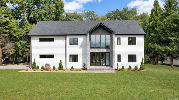 JUST COMPLETED! Welcome to 88 Byram Ridge Road, a luxurious new construction offering in the heart of Armonk on one of the most peaceful settings. This 6, 500+ sqft home is built with oversized Anderson windows which bring in an abundance of natural light and allow you to enjoy the serene lake setting from several rooms in the home. Upon walking inside, you will be impressed by the grandeur of the 11 foot ceilings, wide open concept layout, and handsome 7 1/4&rsquo;&rsquo; plank floors. The chef&rsquo;s eat in kitchen is bespoke from Italy with an oversized center island that seats four, waterfall Quartz countertop, Thermador cooktop, double oven, and refrigerator/freezer. The kitchen flanks the great room with sliders to the exterior deck as well as the dining room and living room area. It is the perfect layout for entertaining formally and informally with friends or family. The first floor also contains a home office or alternate fifth bedroom with full bathroom. Upstairs, you are greeted by 9 foot ceilings w. a sitting area that partitions the two wings of the second floor. The primary suite has vaulted ceilings, a private upper deck with views of the lake, ensuite bathroom with double vanity, designated vanity area, and two walk in closets. The remaining three bedrooms all have ensuite bathrooms and are generous in size. The second floor laundry checks the final box for easy living. In the lower level, you will find a bathroom, recreational space, and opportunity for buyer customization. Come have it all: a vibrant downtown, lake setting and turn key new construction living.