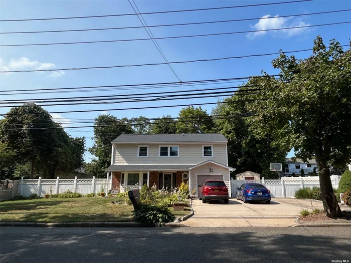 Half Hollow Schools!! Curb Appeal!! Large House & Yard. Newish Roof, Windows, Updated Siding and Eat In Kitchen! Big Deck w Shed. 4-5 Bedrooms! Basketball Court in The Backyard! Huge Driveway! So Much More!