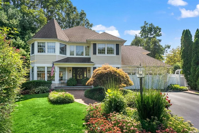 Look no further! Pristine recently renovated Colonial on just over a 1/4 acre at the end of a treelined cul-de-sac. Greeted by front covered porch, prepare to be impressed upon entering sun-filled two-story foyer with wainscoting, crown mouldings and hardwood floors throughout. Eat-in kitchen features double wall oven, quartz countertops, sleek white cabinetry, and adjoining family room with built-ins and fireplace create one spacious room, perfect when entertaining. Formal living room, dining room, half bath, home office/en-suite bedroom, and mudroom off 2 car garage complete the first level. Second level encompasses 4 bedrooms, including primary en-suite bedroom with two closets and luxurious bathroom. Full basement with laundry, storage and potential additional living space not to be missed. Glass sliders off family room lead to tranquil patio surrounded by plantings and fully fenced backyard. Full house security system and generator. Situated only minutes to Huntington Village, parks, beaches and more. Taxes: $21, 184/yr