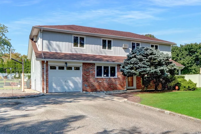 Welcome to 3 Cardinal Lane, a spacious Colonial Splanch home in the Elwood School District. Located on a sought-after street, this property features an updated kitchen with granite countertops and stainless steel appliances. The backyard is perfect for entertaining, with an oversized L-shaped 20x40 pool with a 12x15 shallow end and a 12x16 shed. Inside the home, enjoy a large family room with a wood-burning fireplace and a formal living room with tall vaulted ceilings and hardwood floors beneath the plush carpeting. Upstairs, the home boasts two primary bedrooms, each with ensuite bathrooms and walk-in closets. There are two additional large bedrooms upstairs with a third full bathroom. A fifth bedroom is located on the first floor, which can also serve as a home office. Additionally, there is a half bathroom on the first floor that can easily be converted into a full bathroom. The home also includes a one-car garage and a partial basement, currently used for storage and a home gym.