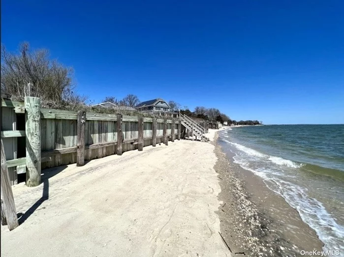 Welcome to a highly sought-after waterfront location in Laurel. This quintessential cottage, nestled at the end of a private street directly on the Peconic Bay, was last offered over twenty-five years ago. It features a sandy beach with approximately 100 feet of bulkhead, a spacious front yard, expansion opportunities, and room for a bay-side pool. This is a rare opportunity to own a piece of waterfront living at a perfectly positioned price. The property also includes a three-car detached garage. Must see to believe the unobstructed views!