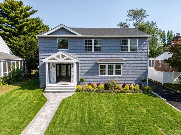 This amazing home was completely rebuilt in 2024 only leaving the original foundation. There is truly nothing better than NEW. Upon Entry you are greeted by an amazing lofted entry foyer with chandelier also visible from the outside through the large front window. The open concept leads you from the foyer into a beautiful kitchen with an island large enough to handle any type of food prep of dinner party you could throw at it. It truly has a grand feel as you leave this amazing kitchen and enter the formal dinning room. Every room has ample space and the tile and flooring colors really complement one another. You can get lost in the master bedrooms walk in closet and cant help but stand in awe of the size of the master bath. There is a laundry room on the second floor for the owners convenience. Navien boiler gives on demand hot water, Forced hot air, central air, and extra insulation adding to the homes efficiency. Out side the new patio was done in an elegant blue stone perfect for enjoying your new yard. This is truly and extraordinary home you must see.