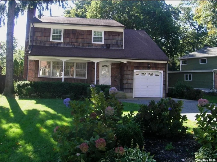 Absolutely Charming Colonial built in 1965 located in The Hillwood Terrace section. Featuring a classic Brick and Cedar exterior, formal entry, Living Room with Fireplace, Dining Room, Kitchen, Family Room, 4 large bedrooms and 1.5 Baths. Hardwood Floors, Gas Heat, 1 Car Garage, Full Unfinished Basement, Wood Deck, Fully Fenced Yard with Beautiful Specimen Plantings, 1 mile to Huntington Village Shops, Restaurants, Numerous Music Venues, Heckscher Park, 2 fabulous libraries YMCA, , and Long Island Rail Road, Huntington School District 1/4 mile away , access to Huntingtown town beaches! Low Taxes $10453.80 before basic star rebate.