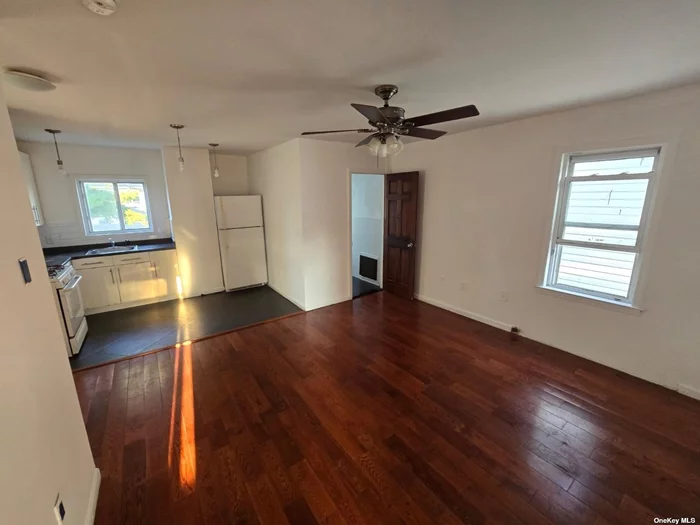 Commuters Dream 2 Bedroom Apartment In The Heart Of Everything!! Hardwood Floors Throughout, High Ceiling, 2 Floors, Heat & Water Included,  Walk to E/J trains and Q54/55/56/60/10 Buses, 10 Min to JFK Airport, Steps From Supermarket, Hospital, Etc Etc