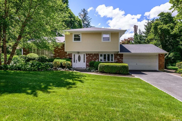 Step into a world of comfort and elegance with this stunning Split Level home, where modern updates meet inviting spaces. With four spacious bedrooms and two beautifully appointed baths, this residence is designed for both relaxation and entertaining. The heart of the home has an open floor plan with a the new white kitchen-features an island and stainless steel appliances, seamlessly flowing into the open living areas. Many Updates include new siding, new roof, freshly painted, new central air conditioning, 200 AMP electric, new modern staircase, updated bathroom, new sprinklers, gas burner, hot water tank,  . , Outside, discover a beautifully landscaped property, meticulously maintained with fenced-in yard and a slate patio, perfect for enjoying sunny days. With thoughtful updates throughout this home is ready for you to make it your own! All this and more can be yours....Move right in!