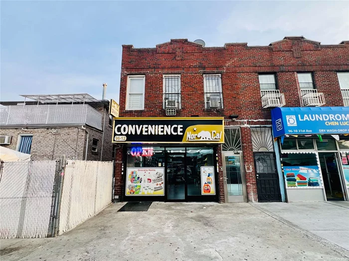 All brick mixed use corner property with low taxes and low maintenance costs in East Elmhurst, Queens. Building features a large storefront on first floor (delivered vacant) and 2 two bedroom residential apartments on the second floor. Store is a generous 1216 sq ft with two bathrooms, roughed out commercial kitchen, access to basement and access to backyard. Currently setup as a convenience store (Rent: $6, 000/mo VOT). Second floor features a 2 bedroom/1 bath front unit in average condition (Rent: $1, 750 MTM) and a 2 bedroom/1 bath rear unit in original condition (Rent: $1, 790 MTM). Both residential tenants are in good standing and pay on time every month. Building also features a fully finished basement and is located right on 31st Ave which is a busy thoroughfare in the area. 2 blocks from Northern Blvd, 1 block from Astoria Blvd. Interest rates are coming down, ensure a solid return with this 7.5% cap rate in a prime area of Northwest Queens. Ideal for 1031 exchange, business owner, and/or income investor. Take advantage of this great opportunity!