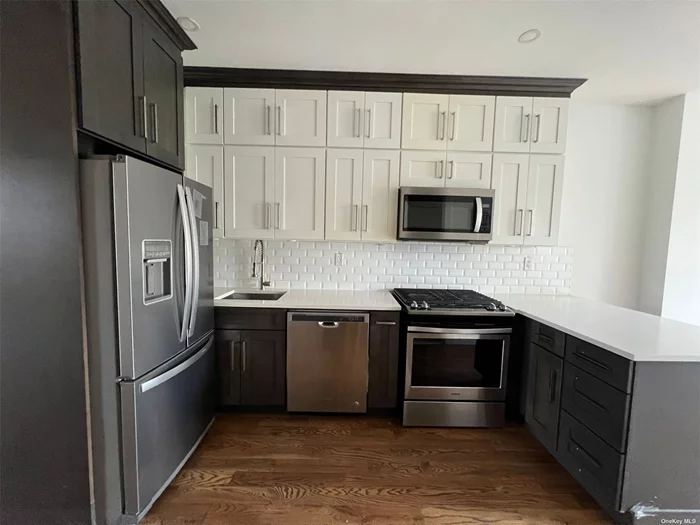 Gorgeous 3 bedroom and 2 full bath . Top floor apartment Super large kitchen tons of cabinets Central air , Dishwasher and microwave , tenants pay their own utilities. Lots of daylight , laundry room in the lower level