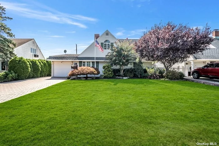 Quintessential Wantagh expanded cape nestled in the duck pond section of town. This home has fabulous curb appeal, and exudes pride in ownership. The first floor is beautifully updated in grey and white tones. The Kitchen has white shaker cabinets, stainless steel appliances and granite countertops, along with plenty of storage, and opens to the oversized sunlit living room with large windows and a slider to the back deck and yard. The first floor also has a nicely sized primary bedroom, second bedroom/office and a newly renovated full bathroom with a large stall shower, granite countertop and custom tile work. Upstairs you will find 2 additional bedrooms and a half bathroom, with plenty of storage and a cedar closet. The long and wide paver driveway leads to a spacious attached one car garage, which has an automatic opener and connects to the laundry area. The backyard has a wood composite deck and lovely canvas awning, along with lots of green space. Other amenities include a fully fenced yard, central AC, security system, and Generac generator. This is a Wantagh must see. This one will not last!