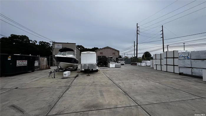 Prime Location G-Zoning Light Industrial Fenced Concrete yard In Busy Area. Ideal for Contractors or Landscapers. Approximately 5500 perfect for entire fleet. Security Cameras 24/7. Own Gate with lock. No Work Permitted - Only Storage.