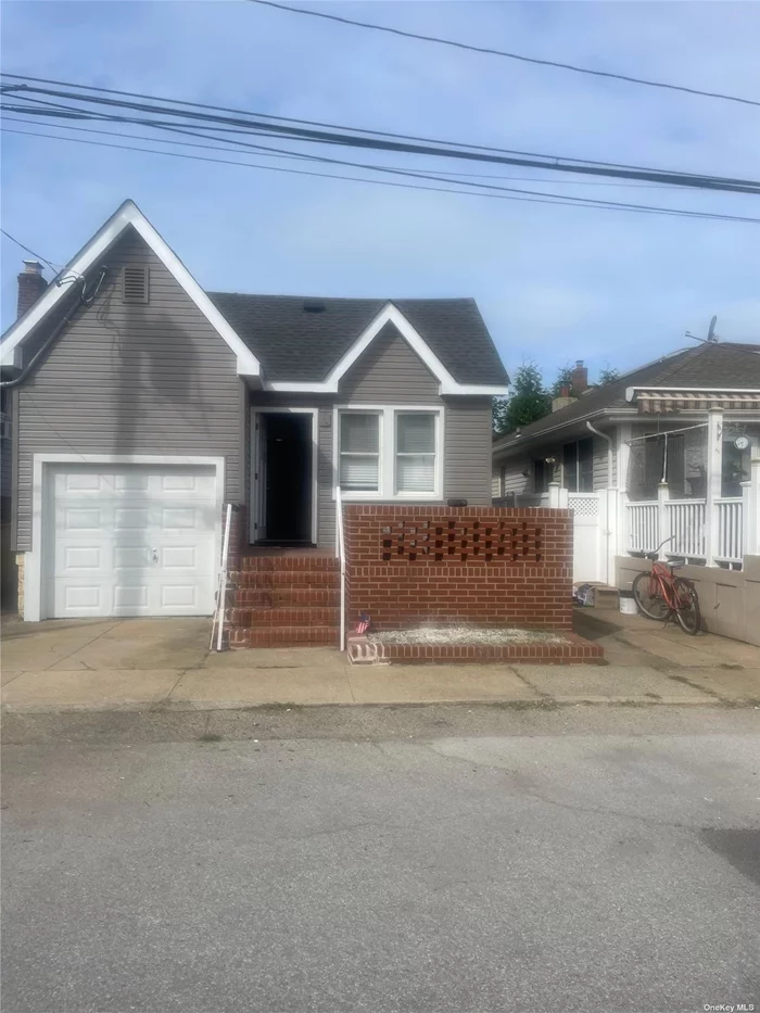 Whole house on beach block. The home features all new - Kitchen, bathroom, siding, roof, washer, and dryer. Garage parking. Freshly painted. Storage and washer/dryer in basement.