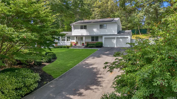 Stunning four bedroom Center Hall Colonial picturesquely set on one acre of landscaped grounds. This beautifully updated and renovated to perfection home features an open & airy floor plan, custom millwork & moldings and hardwood floors through out. The amazing great room with gas fireplace is highlighted with walls of windows & french glass doors that lead to the expansive stone patio area. Adjoining the great room is the large center island chefs kitchen with custom inset cabinetry, Taj Mahal Quartzite countertops and top of the line appliances. A formal dining room, guest bath & laundry complete the first level. As you ascend to the second floor you are immediately greeted by the detailed shadow boxed moldings lining the staircase and hallway that lead you to the primary bedroom w/full bath plus 3 additional bedrooms & full bath. A full lower level with gym. Additional features include Gas Heat, CAC, two car garage w/epoxy flooring, new vinyl siding, updated windows, solar panels, beautiful paver stoned patio & walk ways. Convenient to all! A must see!