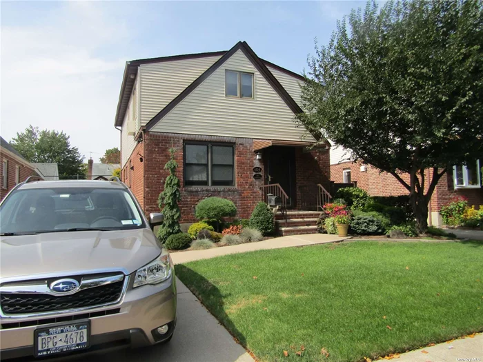 Charming, fully dormered Cape in Bellerose with storage galore! This immaculate, bright and sunny home is in move-in condition. Located on a quiet tree lined street, it has much to offer. A renovated kitchen, two renovated full baths, partially finished basement. All bedrooms are generously sized and one of them is on the main level. The Master has its&rsquo; own private covered deck on the 2nd level, as well as his and her walk in closets. There is the possibility of a 4th bedroom/office if desired. Living, dining and family rooms share an open concept, yet are well defined. The property is beautifully landscaped, and the rear yard is an especially stunning oasis, featuring an awning covered deck, perfect for outdoor dining and entertaining. There is an irrigation system in place for both front and back of the property and landscape lighting is in place as well. All backyard furniture stays with this home as a gift to the buyer. The home has a security alarm system. A 50 bottle dual-zone wine refrigator is includes with the appliances. Close to all, and in SD#26.