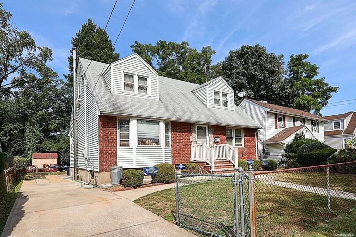 Calling all investors, handymen/women and ambitious end users! Bring your toolbox or contractor and your imagination! Some TLC required to transform this 6 bedroom rear dormered cape into your new home! 2 full baths, formal living room, formal dining room, eat in kitchen with electric cooking. Full, partially finished basement. Hardwood floors under the carpet on the main level. Electric panel updated to 200 amp in 2019. Oil burner updated in 2021. Aboveground oil tank. Fully fenced 50 x 100 property. This home is being sold AS IS. Taxes (before STAR): $11, 711, 74. Conveniently located across the street from Martin Bunky Reid Park which offers residents a community pool, playground, picnic area, horseshoe pits, volleyball, basketball, handball, tennis, and shuffleboard courts. Residents can also obtain a permit for use of the soccer field and Little League baseball field. Don&rsquo;t miss this opportunity!