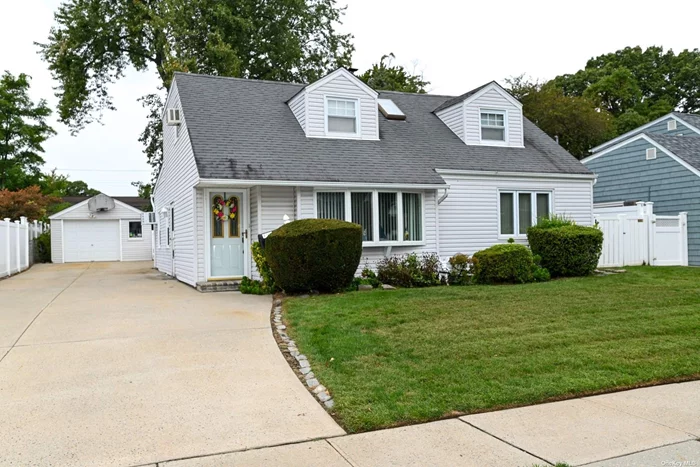 This large expanded cape style house checks off all your boxes. 5 generous sized bedrooms and 2 full baths,  a large eat in kitchen, large dinning room and living room. The kitchen was renovated in 2019 with quartz counter tops, wood cabinets and stainless steel appliances. The roof was replaced on the rear side of the house in 2019 as well. This house sits mid block location on a huge piece of property, perfect for entertaining or just enjoying the outdoors. The property has been professionally landscaped and there are multiple gardens and fruit bearing bushes.  Nothing needed but to unpack your bags.