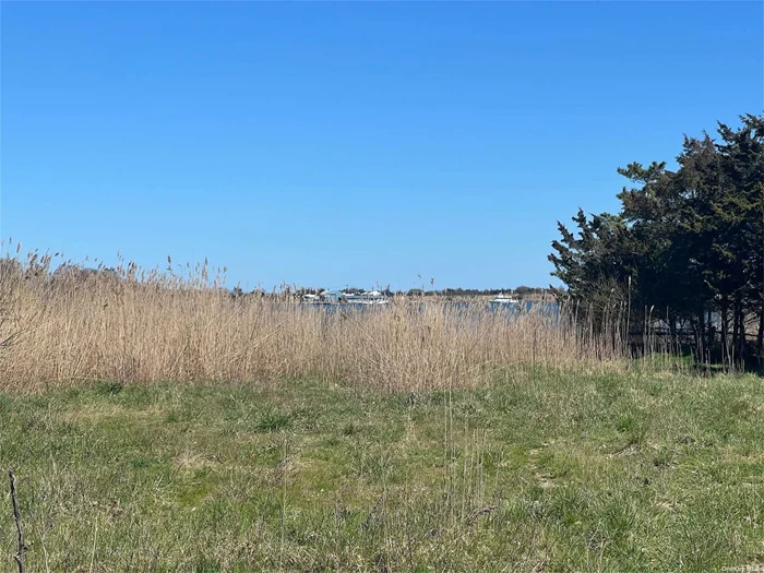 Incredible rare find- buildable waterfront lot with incredible views. Half acre plot with water access. Build your dream home, buyer to obtain all permits at their own expense.