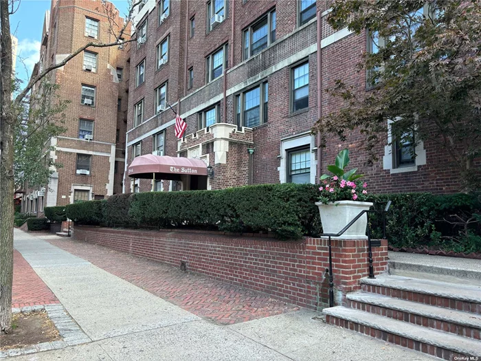 Premiere pre-war building in prime Forest Hills location featuring High ceilings, Arched doorways, hardwood floors, renovated windowed kitchen with stainless steel appliances, and modern bath with separate tub and shower. The sun-drenched, expansive living room and dining room boast 9 foot vaulted ceilings facing westerly direction. The primary bedroom will accommodate a king size and offers customized closets. The second bedroom with its arched doorway and french doors will accommodate a queens size. The building offers a part time doorman, resident superintendent, and full maintenance staff. It is also a pet friendly building, dogs and cats with limited weight. Sublet is permissible after 1 year and a maximum of 3 years. In addition to the many closets within the unit, additional storage and a bike room are available in the basement. The common laundry room also located in the basement was recently renovated. The Sutton is conveniently located with easy access to LIRR, Subway, express and local buses, shopping, schools, restaurants, and a short ride to the airports and parkways.