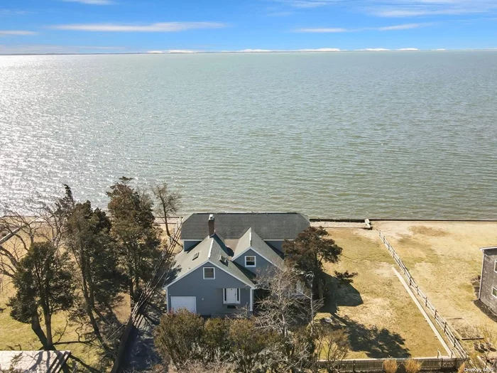 A slice of waterfront paradise! Located within the Bellport Beach Estates neighborhood, this spacious 4 bedroom 3 full bathroom home offers 100 feet of waterfrontage along The Great South Bay plus, access to the association&rsquo;s gated 2 acre beach and recreation area. With 2800 sq. feet of living space, the home&rsquo;s open-concept design and high ceilings create a bright and welcoming atmosphere inviting bayside breezes and offering spectacular vistas out to Fire Island. Fabulous spaces for entertaining family, friends and guests include a living room with a wood burning fireplace, formal dining room, eat-in kitchen, four season room, and an expansive mahogany deck. The primary bedroom is a true retreat, featuring closets galore and a spa-style en-suite for ultimate relaxation. The private balcony offers a tranquil space to enjoy a morning cup of coffee or unwind after a long day while soaking in those Gram worthy Long Island sunsets. Additional complements include hardwood floors throughout, central air conditioning, a 1 car attached garage, and a new septic system. Nestled just a stone&rsquo;s throw from the charming Village of Bellport and a short distance from vibrant Patchogue Village, this property offers a unique blend of peaceful waterfront living and easy access to local amenities boasting a variety of dining, shopping, and entertainment options. Blissful bayside living awaits you!