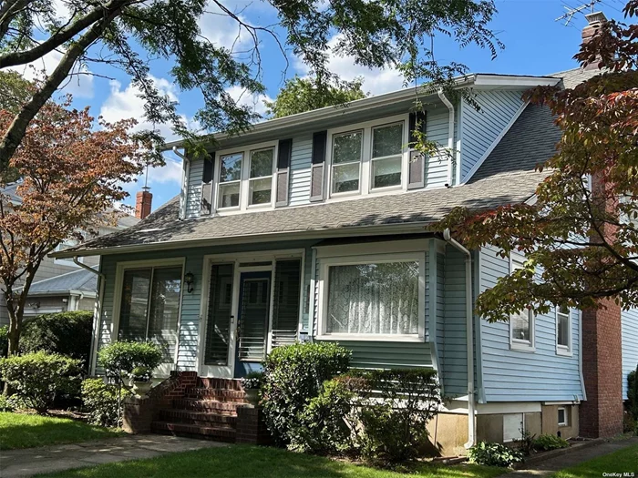 This three-bedroom colonial is located on a quiet dead-end street in the heart of Bellerose Village. It features an enclosed porch, sitting room, living room with gas fireplace, den, formal dining room, eat-in-kitchen, hardwood floors, detached garage, fenced yard and IG sprinklers. Conveniently located to shops, LIRR and highways. This home is waiting for you and your family. Immediate occupancy.