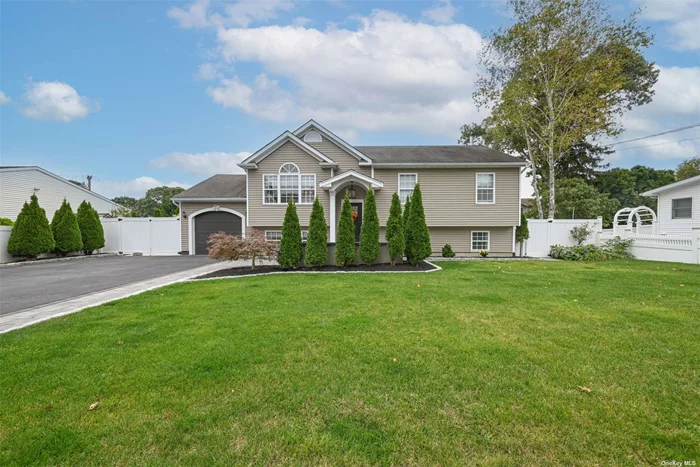 Beautifull, hi ranch home in Ronkonkoma, the first floor offers versatility with an office/den, 2 spacious bedrooms, a summer kitchen, laundry, full bathrooms, all complemented by an outside entrance for added convenience. The second floor welcomes you with an inviting living room with Vaulted ceilings, a formal dining area and bright eat-in kitchen, perfect for gatherings. Three additional bedrooms and a full bathroom, providing ample space for comfortable living. Completing this wonderful home, it features an oasis backyard with an inground heated saltwater pool, perfect for hosting or personal enjoyment.  new pool equipment (heater, filter and liner), a 2-year young boiler and water tank, Central AC ready.